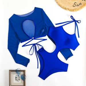 Blue two-piece long sleeve swimwear with mesh top and cutout design on white background