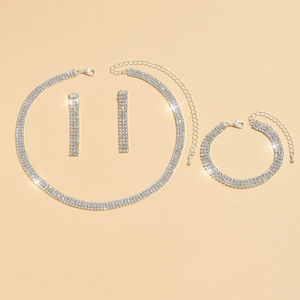 Elegant bridal silver rhinestone necklace set including bracelet and drop earrings