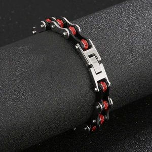 Close-up of industrial style motorcycle chain bracelet with red zircon inlay details