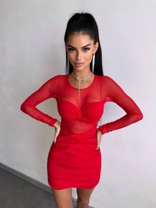 Detail of red slim fit dress showing mesh patchwork sleeves and ruched twist neckline