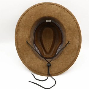 Detailed interior view of brown straw fedora featuring breathable mesh and size label