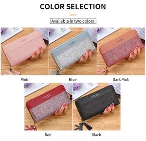 Detail view of colorful patchwork women long wallets with zipper and tassel charms