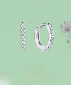 Close-up of S925 sterling silver hoop earrings with pave-set cubic zirconia crystals