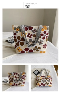 Detail view of ethnic floral canvas tote bag with gray webbing handles and beige base