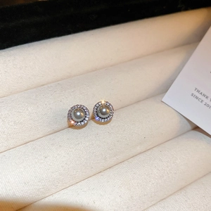 Detail of grey pearl earrings with halo cubic zirconia setting in jewelry gift box