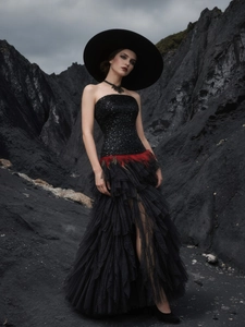 Black sequin tube evening gown with red feather waist and layered mesh skirt