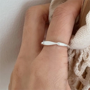 Minimalist 925 sterling silver brushed fish ring shown on finger with sleek metallic finish