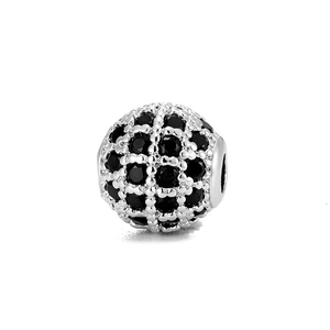 Macro shot of 8mm silver hollow bead with micro-pave black zircon stones for DIY bracelets