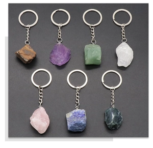 Detailed collection of seven natural stone keychains featuring diverse raw crystals