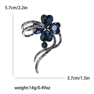 Detailed view of blue heart gemstone brooch with dimensions 5.7cm by 3.7cm