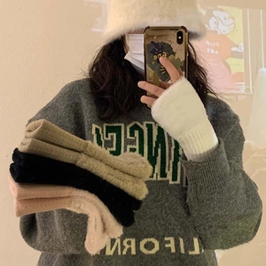 Winter thermal white plush fingerless knit gloves for women shown in a lifestyle mirror selfie