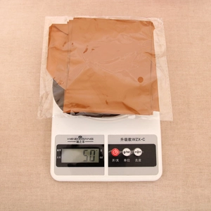 Weight measurement of PVC inflatable reindeer antlers showing 50g on a digital scale