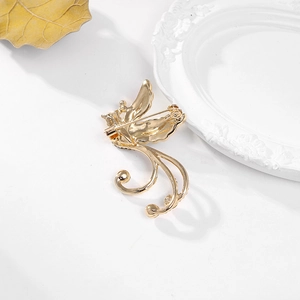 Golden phoenix brooch pin with back pin closure view and elegant relief metal texture