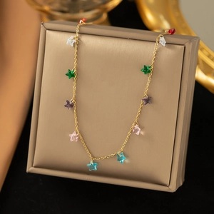 Detailed view of a gold titanium steel necklace featuring multi-color star crystal charms