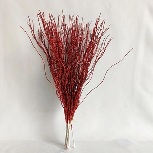 Macro shot of 43cm glitter-coated red decorative stems for festive Christmas arrangements