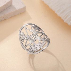 Elegant silver stainless steel open ring featuring cut-out star and eye pattern designs