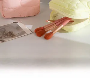 Quilted heart pattern makeup bag set with travel brushes in soft pink and yellow