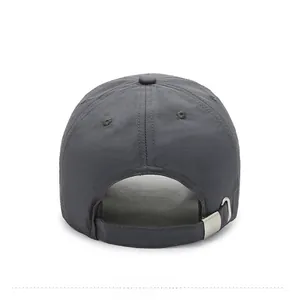 Detail of dark grey quick-dry baseball cap featuring an adjustable silver metal buckle