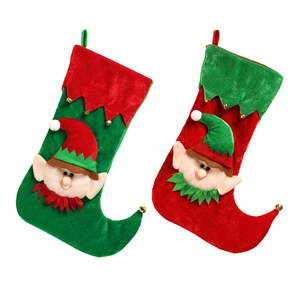 Christmas elf gift bags with red and green velvet textures and bell decorations
