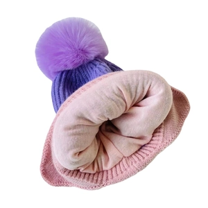 Kids purple knit beanie with thick fleece lining and oversized fluffy faux fur pom pom