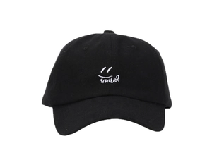Close-up of smile embroidery on black cotton baseball cap with six-panel structure