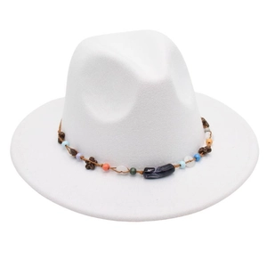 Detail of white felt fedora hat featuring a bohemian colorful beaded band with charms