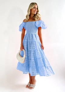 Detail of light blue off-shoulder dress featuring plaid texture and puff sleeves