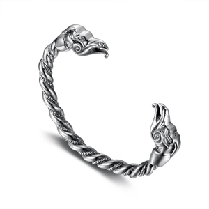 Vintage Viking bangle with twisted cable design and carved mythical beast heads