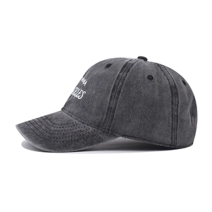 Detail of grey washed baseball cap showing white Los Angeles California embroidery