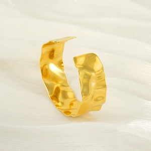 Minimalist hammered 18K gold C-shape open bangle with irregular wavy texture for women