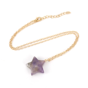 Close-up of a purple star-shaped crystal pendant with an adjustable gold-tone metal chain