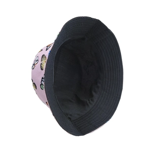 Detail of pink butterfly print bucket hat with a reversible solid black inner lining
