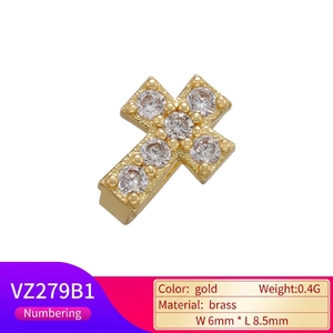Miniature gold brass cross pendant with cubic zirconia stones size 6mm x 8.5mm