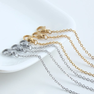Polished stainless steel cross chains with lobster clasps in gold and silver finish