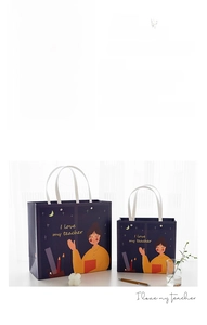 Detail of premium navy Teacher's Day gift bag with gold stamping and rivet handles