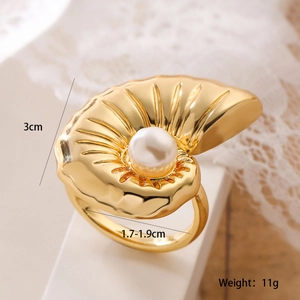 Macro shot of gold shell ring with white pearl, showing 3cm width and dimensions