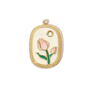 Vue détaillée du pendentif ovale doré vintage avec tulipe rose et petit cristal