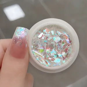 Macro detail of Jade Bamboo opal nail powder with iridescent aurora sequins on long nails