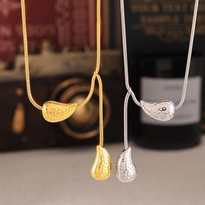 Textured teardrop necklaces in gold and silver finish with minimalist snake chain