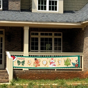 Outdoor Christmas banner with Santa and gingerbread man on balcony railing