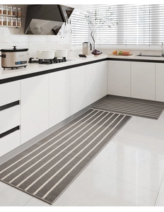 Modern grey and white striped kitchen mat set on tile floor showing durable woven texture