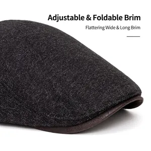 Men's dark grey flat cap with foldable brown leather brim and warm fleece lining