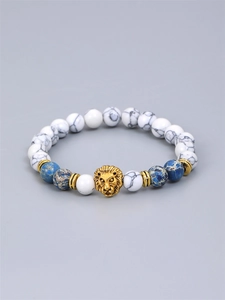 Mens beaded bracelet with lion head charm, white howlite and blue imperial stone