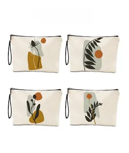 Detailed view of four ink painting floral canvas makeup bags with zippers and wristlets