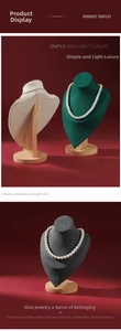 Detailed view of luxury velvet bust stands in multiple colors with solid wood bases