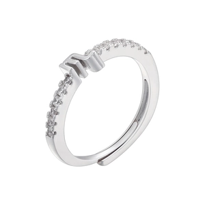 Macro detail of silver Scorpio zodiac sign ring with sparkling cubic zirconia pavé setting