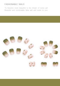 Detail of olive green gradient press-on nails with delicate floral art and small pearls