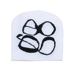 Detail of white Y2K knitted beanie featuring black Gothic jacquard logo pattern