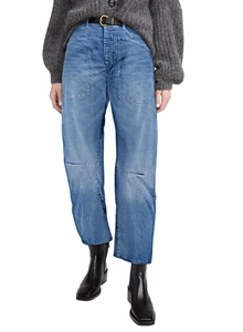 Detail of cargo pockets and washed texture on vintage high-waisted barrel jeans