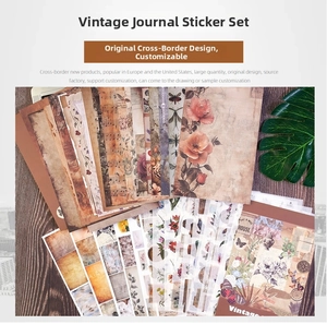 Macro detail of vintage scrapbook kit featuring floral and butterfly motifs on aged paper